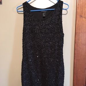 Black, knee length, sequin dress .